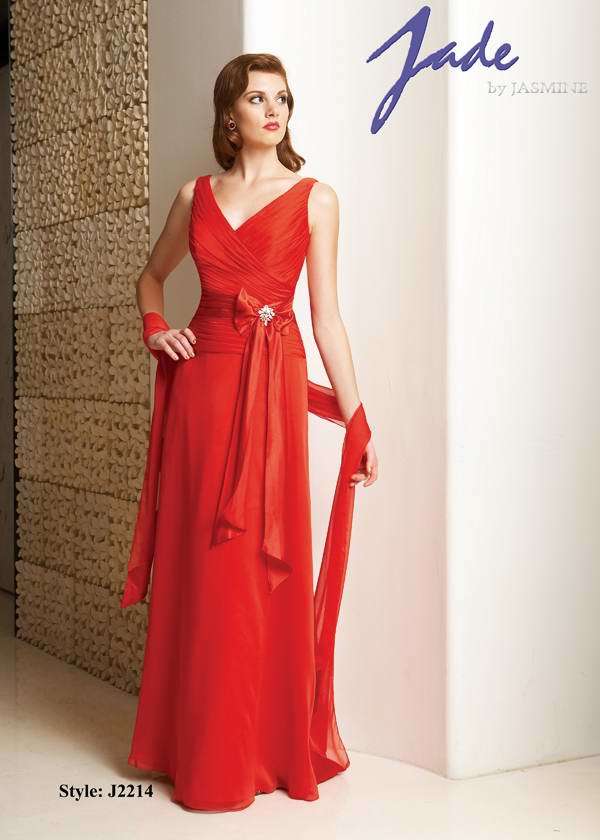 Prom Dress: JADE - J2214  Catalogue Color:  MANGO TANGO (PG)  Silhouette:  Jade Tiffany Chiffon gown has shirred front and back V neckline bodice with Charmeuse waistband. Flare skirt and matching wrap with charmeuse edges.  Fabric-top layer:  JADE TIFFANY CHIFFON and CHARMEUSE  Accessory:  Mix fabric of shawl  Skirt Length:  Floor  Size Range:   2-26  