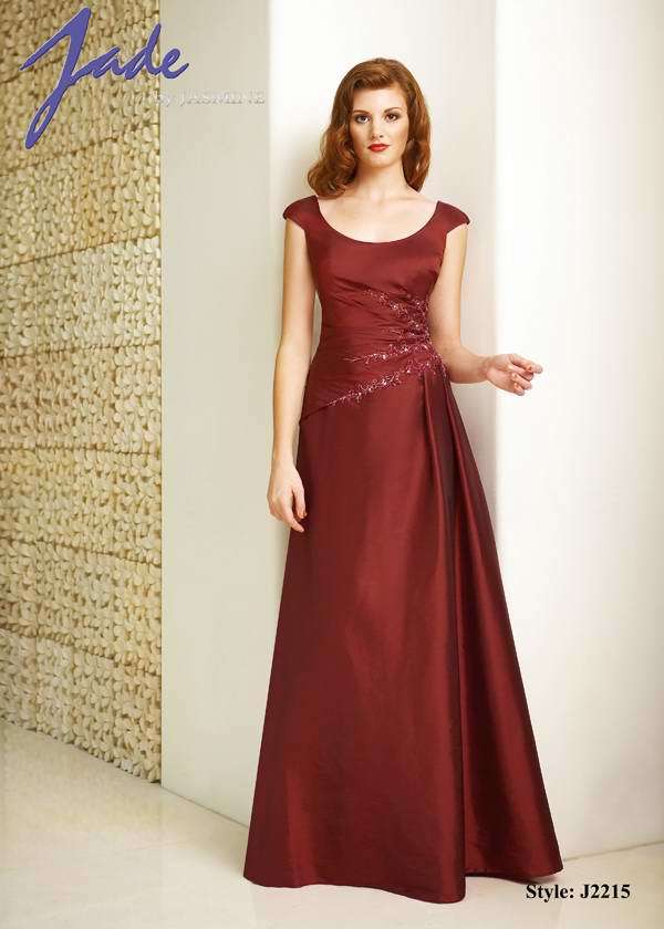 Prom Dress: JADE - J2215  Catalogue Color:  CRANBERRY (CB)  Silhouette:  Jade Taffeta gown has scoop neckline with cap sleeves. Side gathered beaded/embroidered bodice with asymmetric drop waist. Side pleat on skirt and back gathers.  Fabric-top layer:  JADE TAFFETA  Accessory:  N/A  Skirt Length:  Floor  Size Range:   2-26  