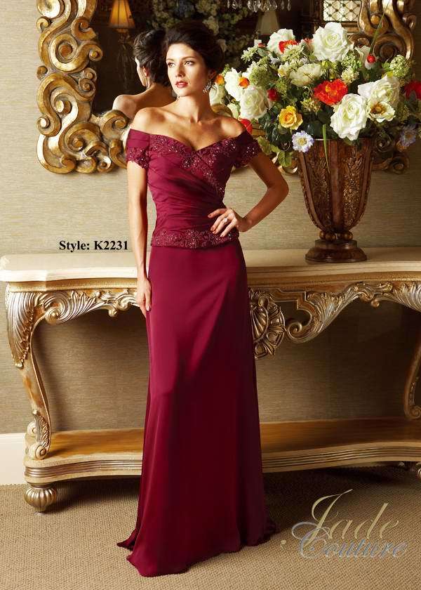 Mother of the Bride Dress: JADE COUTURE - K2231  Catalogue Color:  BLACK CHERRY (BH)  Silhouette:  Couture Satin Face Chiffon and Netting gown has off the shoulder short sleeves with beaded lace gathers. Gathered bodice has beaded lace detail at neckline and drop waist. A-line skirt.  Fabric-top layer:  COUTURE SATIN FACE CHIFFON and NETTING  Accessory:  N/A  Skirt Length:  Floor  Size Range:   2-26  