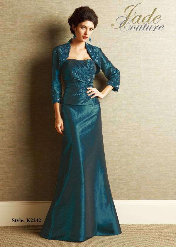 Bridesmaids Dress: JADE COUTURE - K2242  Catalogue Color:  TEAL (TL)  Silhouette:  Silk Dupioni gown has semi-sweetheart neckline, side gathered bodice with beaded lace detail. A-line skirt and matching jacket with beaded lace has scalloped edged neckline and sleeves.  Fabric-top layer:  SILK DUPIONI  Accessory:  Beaded lace of jacket and straps  Skirt Length:  Floor  Size Range:   2-26  