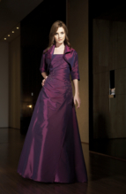 Evening Dress: JADE - J1174  Catalogue Color :  BORDEAUX (BX)Silhouette :  Jade Taffeta gown has straight neckline with side gathered bodice and beaded/emb detail at side neckline and hip. A-line full skirt; matching short sleeve jacket with collar.Fabric-top layer :  JADE TAFFETAGown or 2 piece :  DressJacket :  Front Neckline :  StraplessBack Neckline :  StraplessFront Bodice Detail :  Beaded lace and gatheredBack Bodice Detail :  PlainSleeve :  Gown :  Belt or Sash Detail :  N/AWaist :  AsymmetricFront Skirt Detail : Beaded lace and gatheredBack Skirt Detail :  PlainFront Hem Detail :  PlainBack Hem Detail :  PlainAccessory :  Jacket and strapsSkirt Length :  FloorSize Range :  2-26 