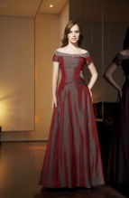 Bridesmaids Dress: JADE - J1183  Catalogue Color :  CRANBERRY (CB)Silhouette :  Jade Silk Dupioni gown has portrait neckline trimmed with beaded/emb; bodice is shirred with drop waist and has beaded/emb side applique. A-line skirt.Fabric-top layer :  SILK DUPIONIGown or 2 piece :  DressJacket :  Front Neckline :  PortraitBack Neckline :  PortraitFront Bodice Detail :  Beaded embroidery and gatheredBack Bodice Detail :  Beaded embroidery and gatheredSleeve :  Gown :  Belt or Sash Detail :  N/AWaist :  NatureFront Skirt Detail : PlainBack Skirt Detail :  PlainFront Hem Detail :  PlainBack Hem Detail :  PlainAccessory :  N/ASkirt Length :  FloorSize Range :  2-26 