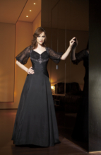 Bridesmaids Dress: JADE - J1184  Catalogue Color :  BLACK (BK)Silhouette :  Jade Silk Dupioni gown has sweetheart neckline with lace empire bodice. Has lace back with keyhole opening and puffed lace elbow length sleeves. Silk Dupioni shirred waist with A-line skirt.Fabric-top layer :  SILK DUPIONIGown or 2 piece :  DressJacket :  Front Neckline :  SweetheartBack Neckline :  BoatFront Bodice Detail :  Lace and beaded embroidery and gatheredBack Bodice Detail :  Lace and beaded embroidery and gatheredSleeve :  Gown :  Belt or Sash Detail :  N/AWaist :  DropFront Skirt Detail : PlainBack Skirt Detail :  PlainFront Hem Detail :  PlainBack Hem Detail :  PlainAccessory :  N/ASkirt Length :  FloorSize Range :  2-26 