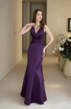 Evening Dress: BELSOIE - L1067  Catalogue Color :  BORDEAUX (BX) Silhouette :   Fabric-top layer :  SUPREME SATIN Front Neckline :  V-neck Back Neckline :  V-neck Front Bodice Detail :  Gathered Back Bodice Detail :  Gathered Waist :  Asymmetric Belt or sash detail : Plain sash Front Skirt Detail : Flare skirt Back Skirt Detail :  Flare skirt Front Hem Detail :  Plain Back Hem Detail :  Plain Two Tone or Solid :  Solid Accessory :  N/A Skirt Length :  Available in floor length. Tea-length can be special ordered, at no additional charge. Size Range :  4-28 