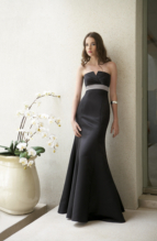 Prom Dress: BELSOIE - L1078  Catalogue Color :  BLACK (BK)-OYSTER (OY) Silhouette :   Fabric-top layer :  SUPREME SATIN Front Neckline :  Strapless Back Neckline :  Strapless Front Bodice Detail :  Gathered Back Bodice Detail :  Plain Waist :  Empire Belt or sash detail : Accent color waistband and sash Front Skirt Detail : Flare skirt Back Skirt Detail :  Flare skirt Front Hem Detail :  Plain Back Hem Detail :  Plain Two Tone or Solid :  Two tone (any combination of 2 SUPREME SATIN colors) or solid. Accessory :  Detachable spaghetti straps Skirt Length :  Available in floor length. Tea-length can be special ordered, at no additional charge. Size Range :  4-28 