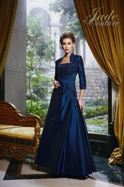 Prom Dress: JADE COUTURE - K2287  Catalogue Color :		NIGHT BLUE (NB)	Fabric-top layer :		LUXE TAFFETA	Accessory :		Jacket and straps	Skirt Length :		Floor length. Skirt length can be changed to tea-length or knee-length.	Size Range : 		2-26 