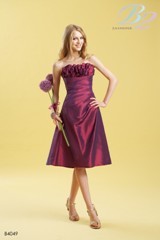 Bridesmaids Dress: B2 SPRING 2011 - B4049  Catalogue Color:		BORDEAUX (BX)	Fabric-top layer:		LUXE TAFFETA	Accessory:		Spaghetti straps	Skirt Length:		Available in both knee-length 25