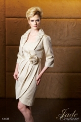 Mother of the Bride Dress: JADE COUTURE - K4438  Catalogue Color:		GOLD (GD)	Fabric-top layer:		BROCADE	Accessory:		Jacket and straps	Skirt Length:		Available in both knee-length 25