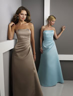 Evening Dress: Bridesmaids Collection: 229 Satin  Contoured, strapless bodice with asymmetrical draping from the empire,cascading onto the overskirt of the A-line gown. Please View the Mori Lee Satin Swatch Card for Color Reference 