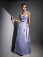 Evening Dress: Ava Collection: 605 Beaded Satin  The draped, surplus bodice features clustered beads at the center of the strapless neckline. A satin band trims the natural waistline with streamers cascading onto the A-line skirt. Please View the Ava Collection Satin Swatch Card 