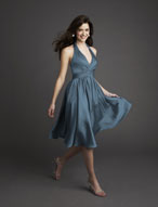 Prom Dress: Bridesmaids Collection: 765 Chiffon  V-shaped halter neckline of soft draping meets the empire, with shirring surrounding the cocktail length skirt. Matching Shawl Included. Color Availability: All Mori Lee Chiffon Colors 