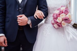 wedding bride with groom holding hands
