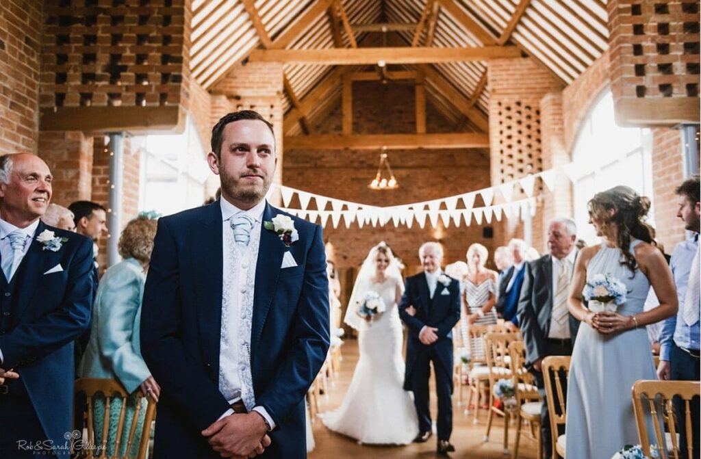 wedding ceremony bride groom entrance second photographer