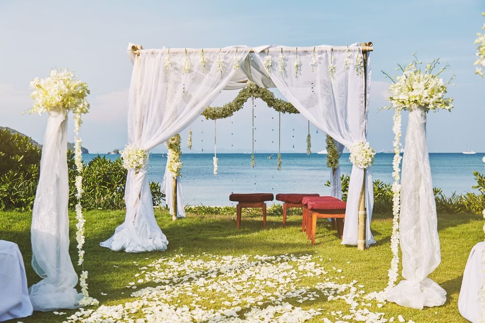 beautiful beach wedding flower arch setting wedding venue with panoramic ocean view