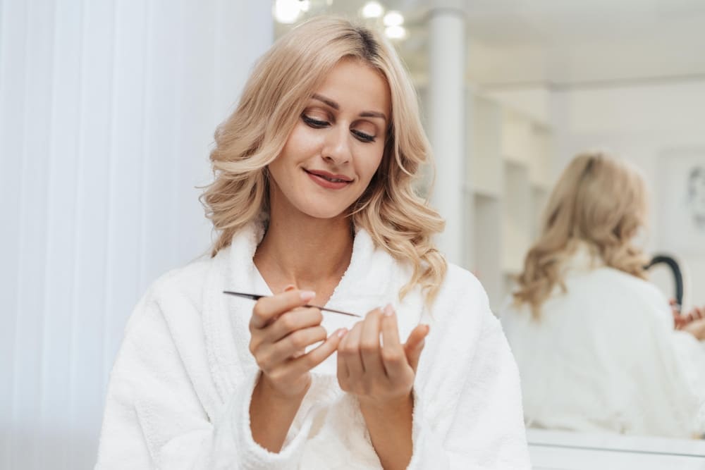 Skincare routine for aging skin, mother of the bride at a vanity with balm jars before the wedding, Frøya Organics