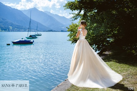 Wedding Dress - Sans Pareil Bridal Collection 2017: 1061 - Bright white lace appliques and plunging V-neckline on pleated A-line dress | SansPareil Bridal Gown