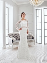 Bridal Dress: Sans Pareil Bridal Collection 2016: 975 - Twirling lace details form illusion neckline and all-over lace in trumpet style dress 