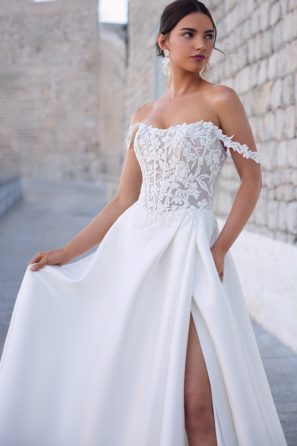 Ivory off-the-shoulder floral lace A-line wedding gown with slit