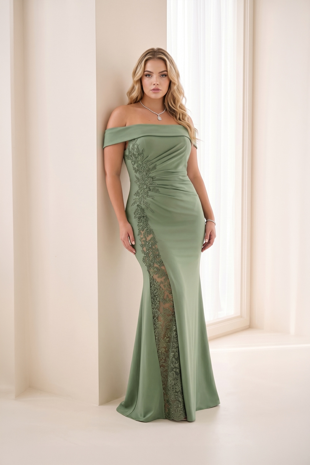 Sage green off-the-shoulder mother of the bride gown with lace detail